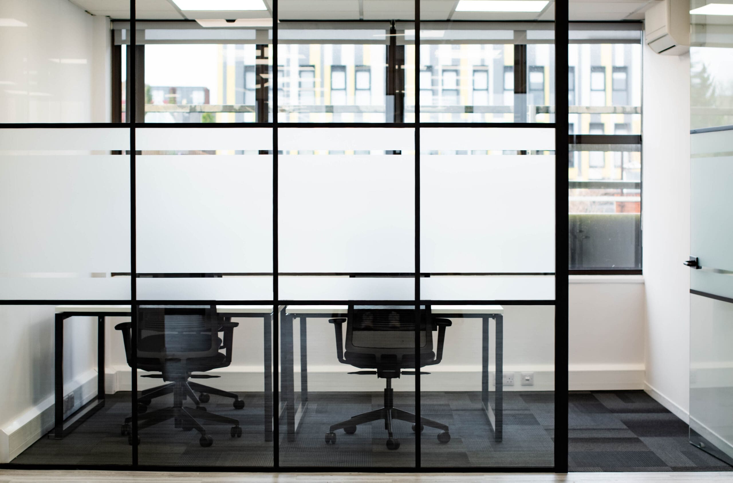 Office with frosted privacy panel glass.