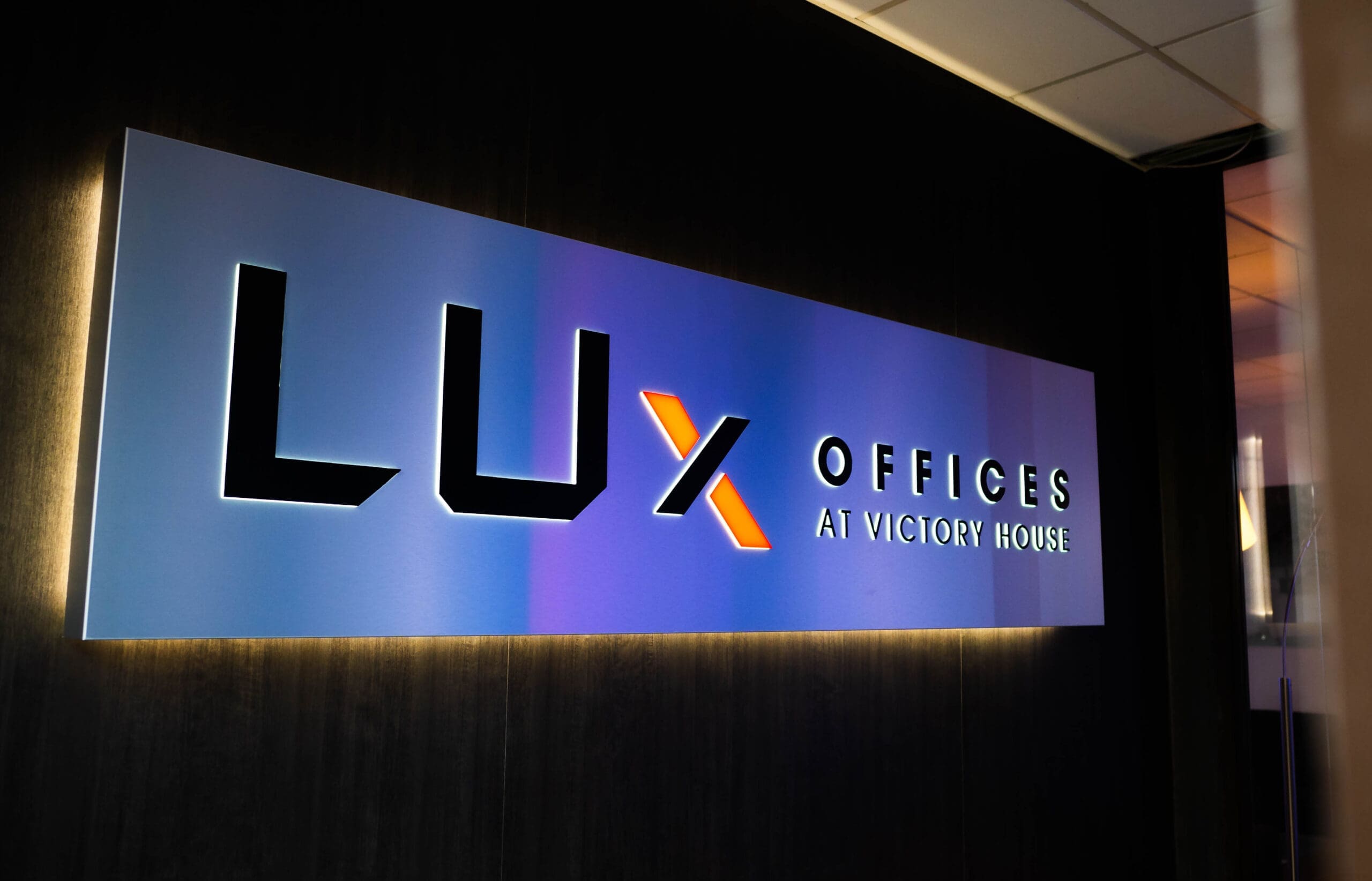 Illuminated Signage in the entrance way of LUx Offices